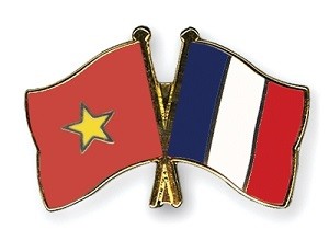 Vietnam France flags - Vietnam Briefing News